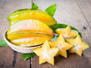 Star Fruit On Wood Background